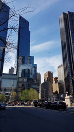 City street and modern buildings against sky