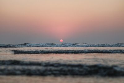 Scenic view of beach at sunset