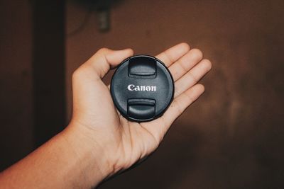 Close-up of hand holding camera