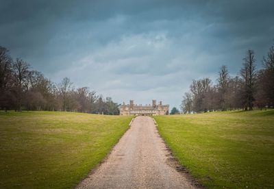 Footpath leading towards grassy field