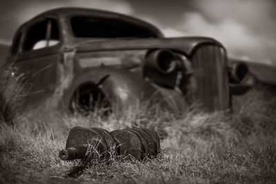 Abandoned car on field