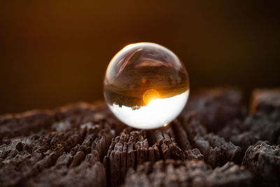 Close-up of crystal ball on wooden table