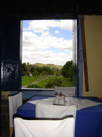 Close-up of boat against sky seen through window