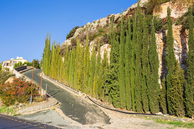 Scenic view of green mountains against clear blue sky