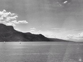 Scenic view of sea against cloudy sky