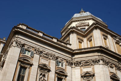 Low angle view of historical building against blue sky