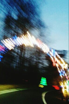 blurred motion, motion, illuminated, speed, long exposure, light trail, transportation, multi colored, defocused, road, night, on the move, city, sky, blue, light - natural phenomenon, leisure activity, outdoors