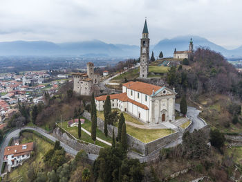 Panoramic view of townscape by buildings against sky