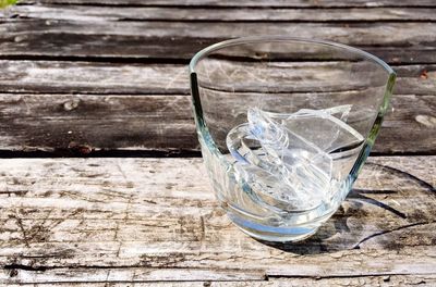 Broken glass on wooden table