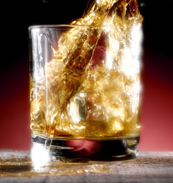 Close-up of beer glass on table