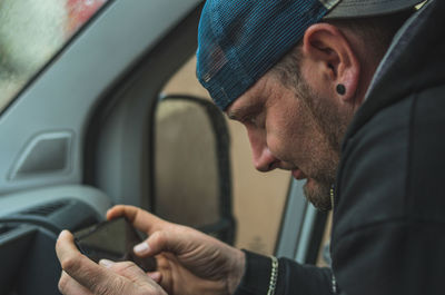 Portrait of man in car