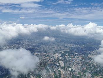 High angle view of buildings in city against sky