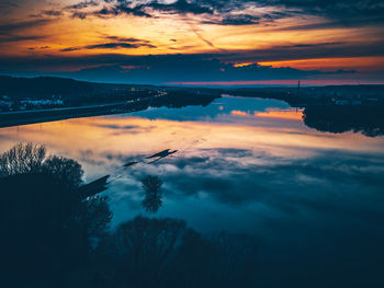 Scenic view of lake against sky during sunset