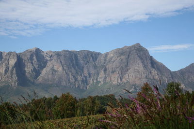 Scenic view of mountains against cloudy sky