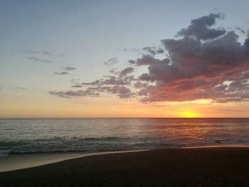 Scenic view of sea against sky at sunset