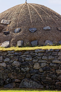 Close-up of stone wall against sky