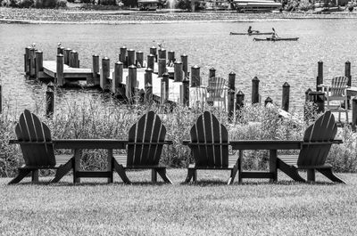 Chairs and tables sitting on bench in water