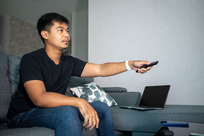 Young man using mobile phone