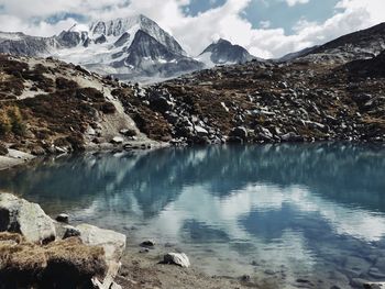 Scenic view of snowcapped mountains against sky