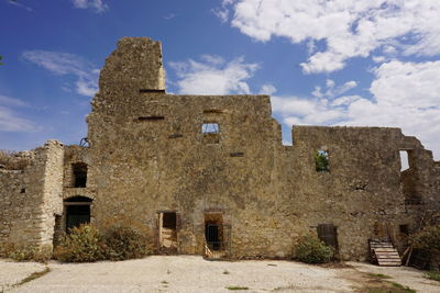 Low angle view of old building against sky