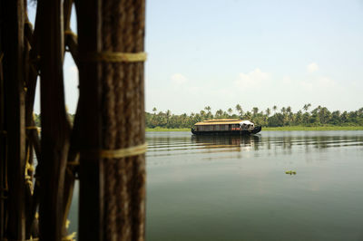 Boat in lake against sky