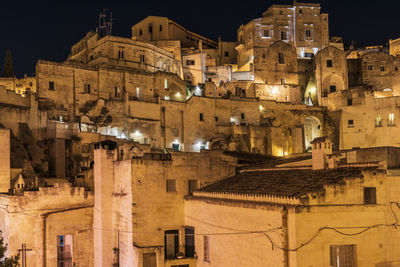 Low angle view of illuminated buildings at night