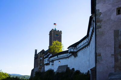 Low angle view of tower against clear blue sky