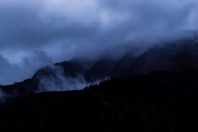 Scenic view of silhouette mountain against sky at night