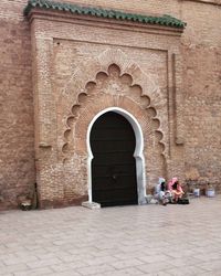 People in front of historical building