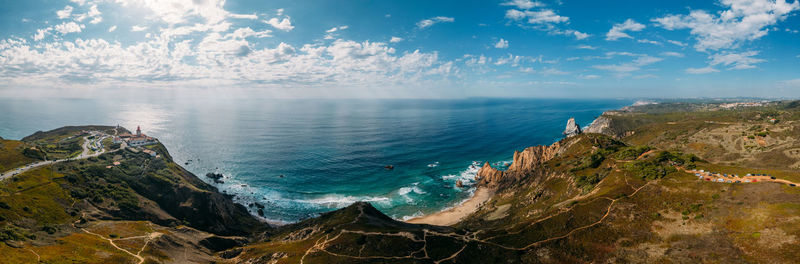 Panoramic 180 degree view of cabo da roca and ursa beach in portugal with hiking trails visible