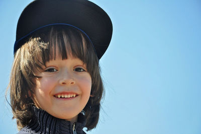 Portrait of smiling boy against clear sky