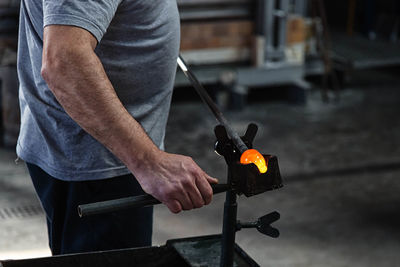 Cropped image of man holding hands