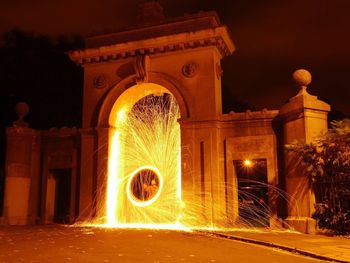 Man performing wire wool at night