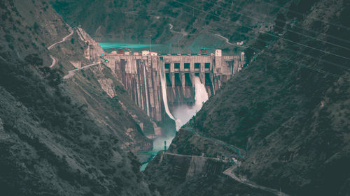 High angle view of dam by mountains