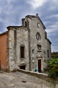 Low angle view of old building against sky