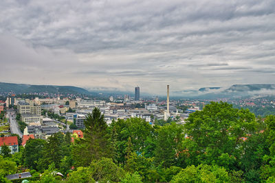 High angle view of trees and buildings against sky