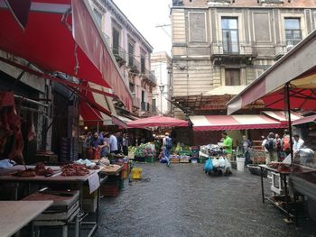 People at market stall in city