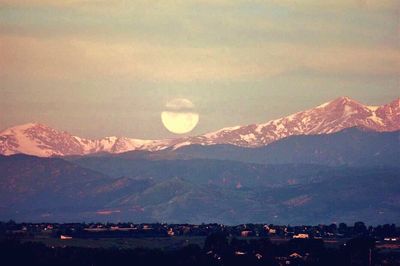 Scenic view of mountains against sky at night