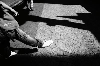 Low section of man sitting on floor