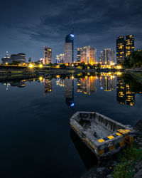 Illuminated buildings in city at night