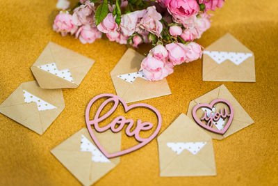 High angle view of pink flower on table