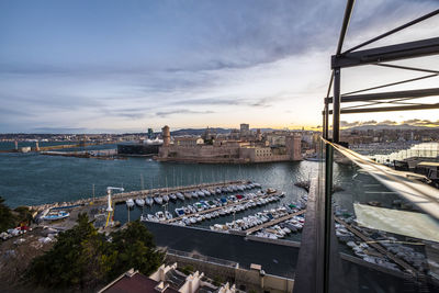 High angle view of boats moored at harbor