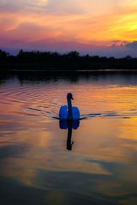 Scenic view of lake at sunset