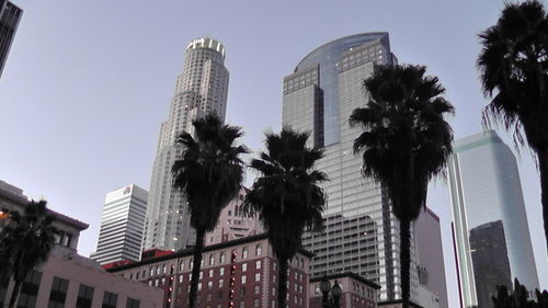 Low angle view of skyscrapers against clear sky