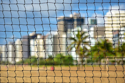 Close-up of fence against the sky