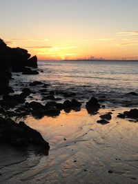 Scenic view of sea against sky during sunset