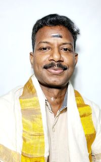 Portrait of young man against white background