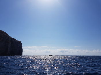 Scenic view of sea against blue sky