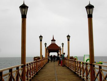 Pier on sea against sky