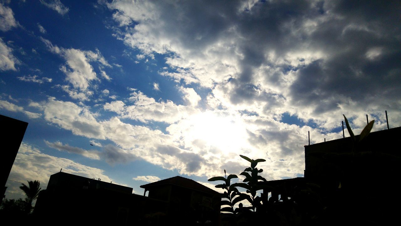 building exterior, architecture, built structure, low angle view, sky, silhouette, cloud - sky, building, house, residential building, residential structure, cloudy, cloud, high section, city, sunset, outdoors, no people, sunlight, dusk